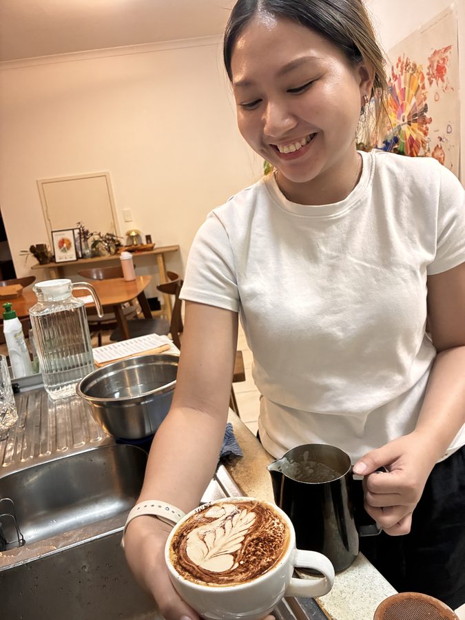 Student with their latte art result