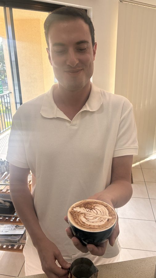 Student admiring their rosetta pour