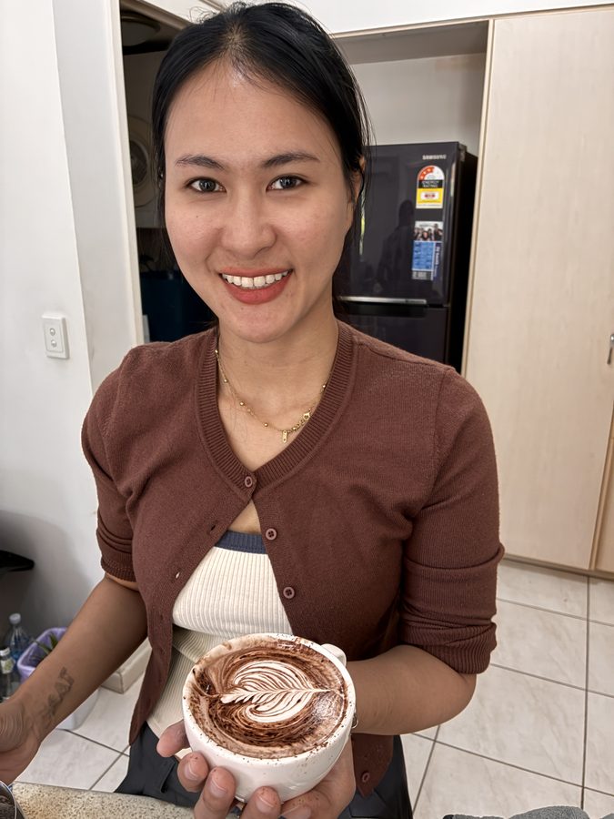 Student with elaborate rosetta pour